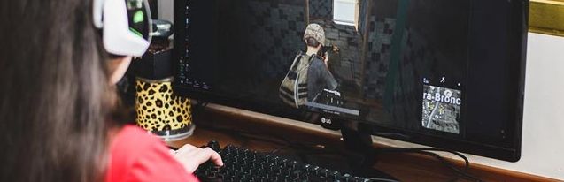 A girl playing video games on PC