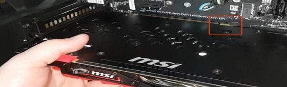 Pulling out a MSI graphics card from the mobo