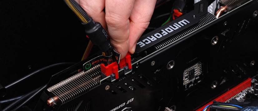 Image of a person connecting Power cables to gpu