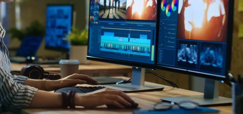Image of two monitors running editing softwares