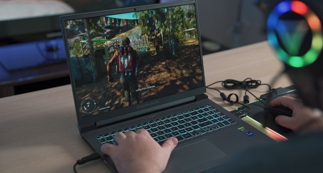 image of person playing far cry on laptop